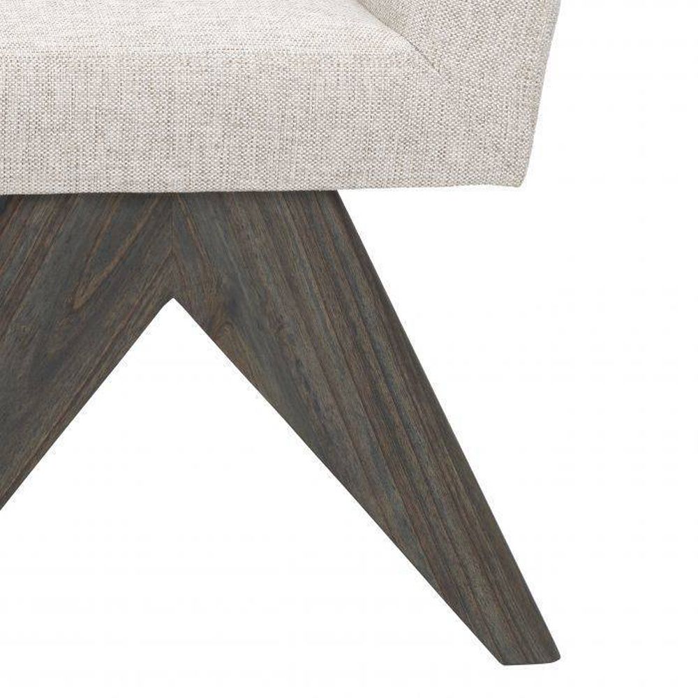 Natural linen dining chair with dark wooden v-shaped legs