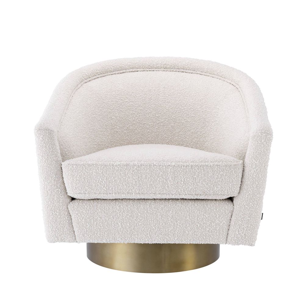 cream coloured boucle swivel chair with matte golden base 
