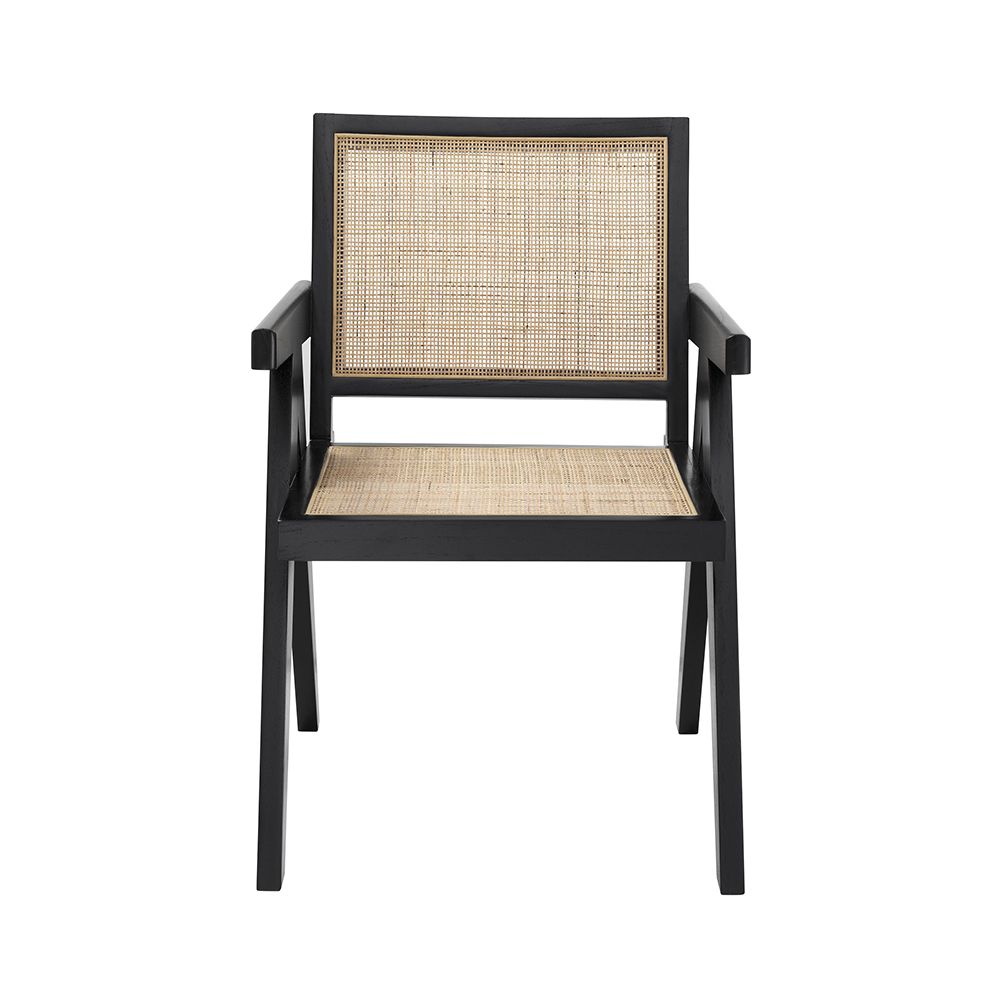 An iconic, black Jeanneret-inspired dining chair with a rattan seat and backrest