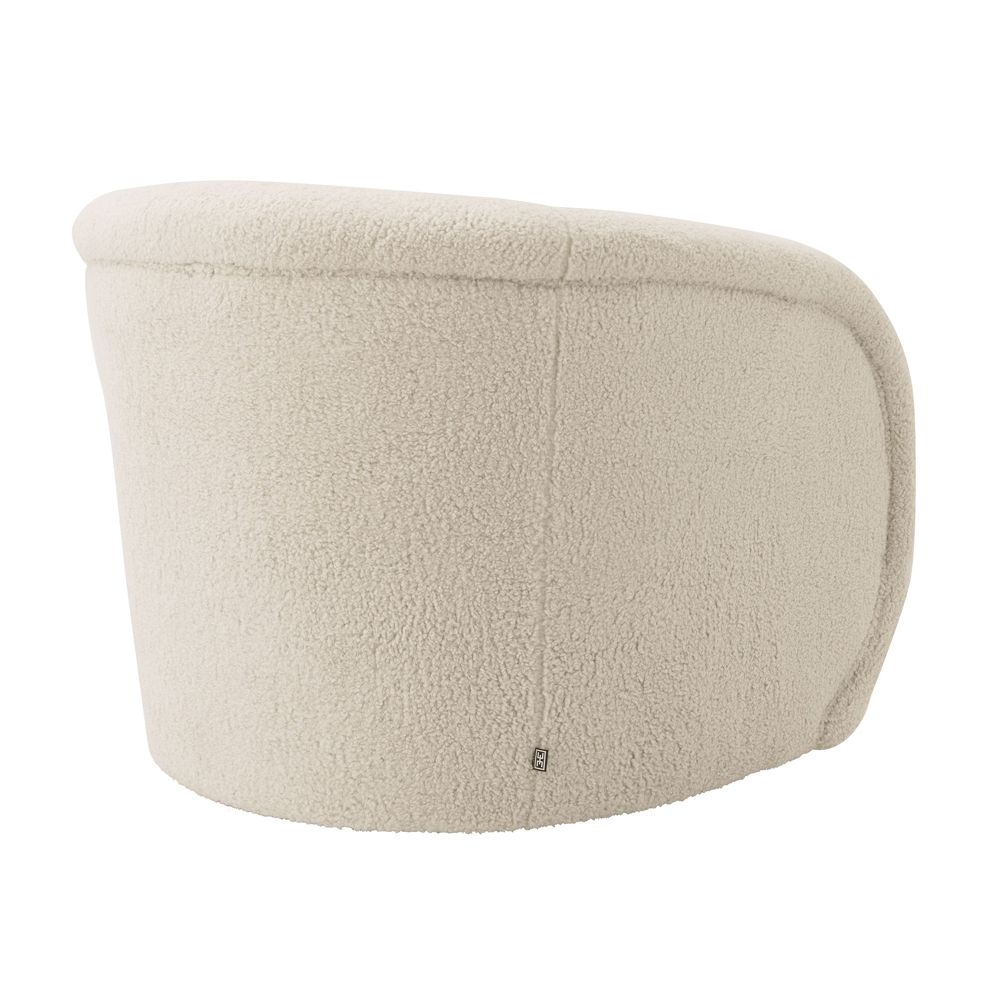 Luxurious curvy natural faux fur swivel chair on brushed brass base by Eichholtz