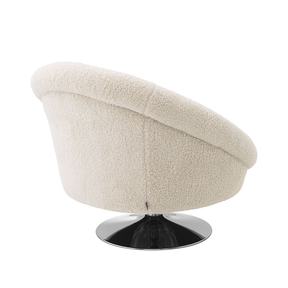 A luxurious chair with Brisbane cream upholstery and a nickel swivel base