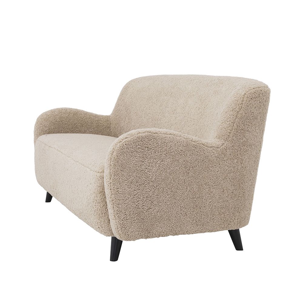 A luxurious mid-century modern inspired Canberra sand upholstered sofa with black legs