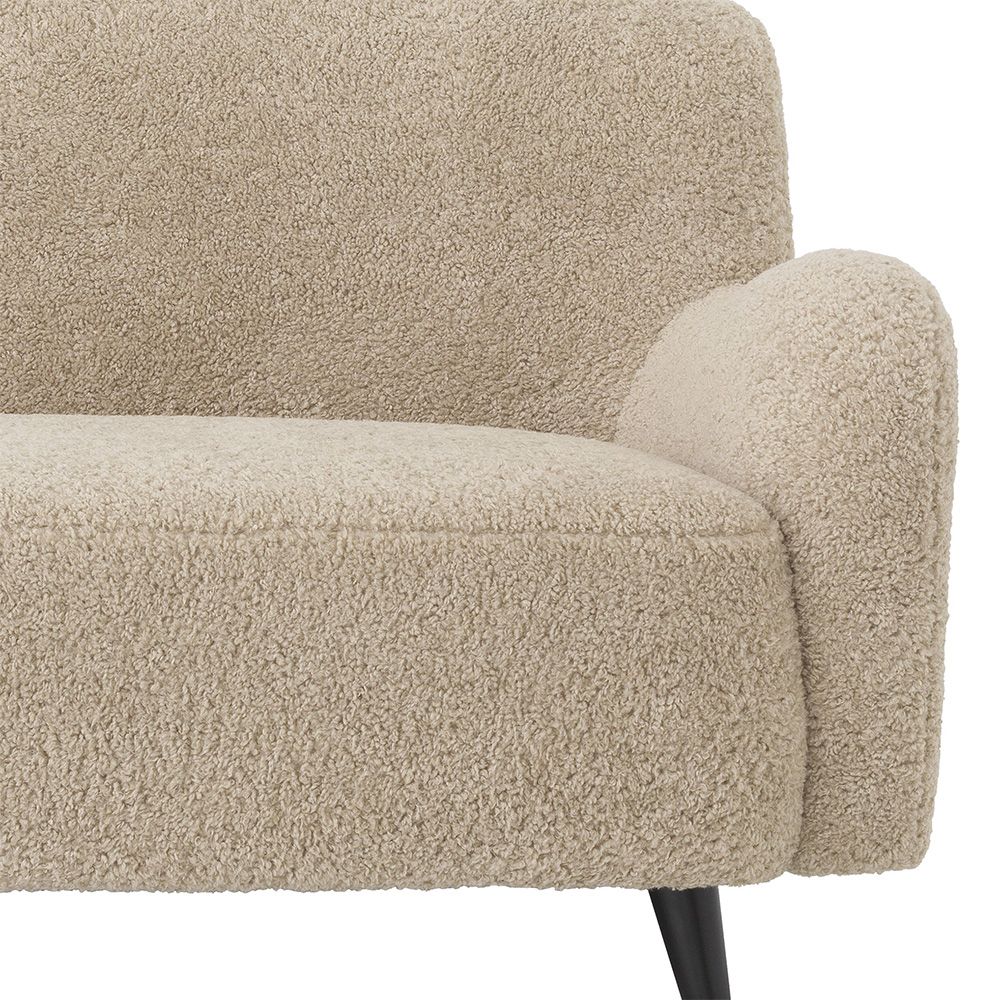 A luxurious mid-century modern inspired Canberra sand upholstered sofa with black legs
