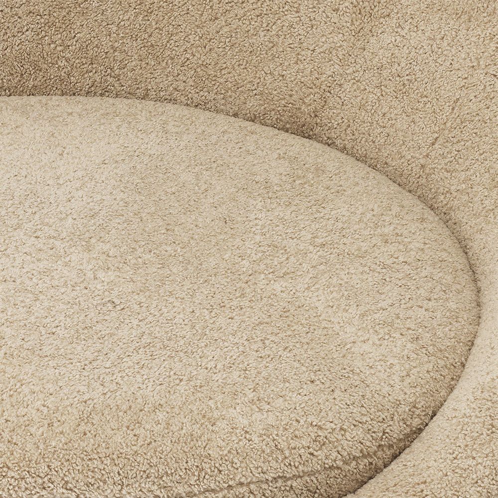 A sumptuous sofa by Eichholtz with a brushed brass base