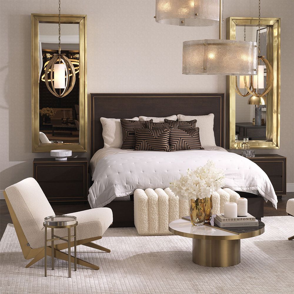 Modern Eichholtz boucle cream chair with brushed brass accents