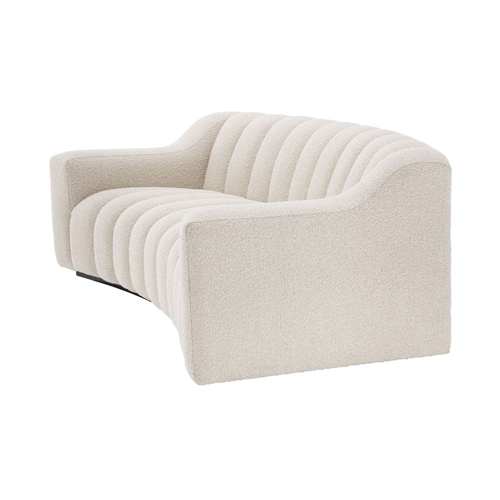 A luscious fluted contemporary sofa with boucle upholstery