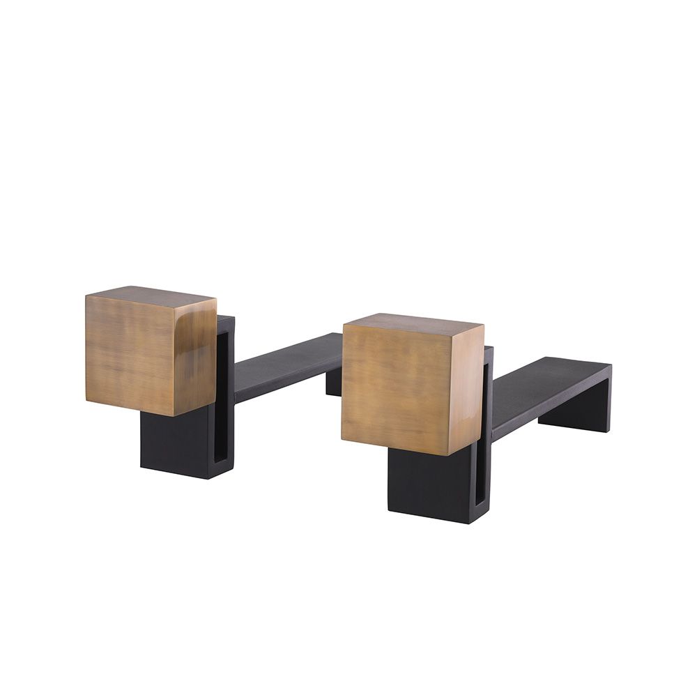 A luxury set of andirons by Eichholtz which feature vintage brass blocks and a black finish
