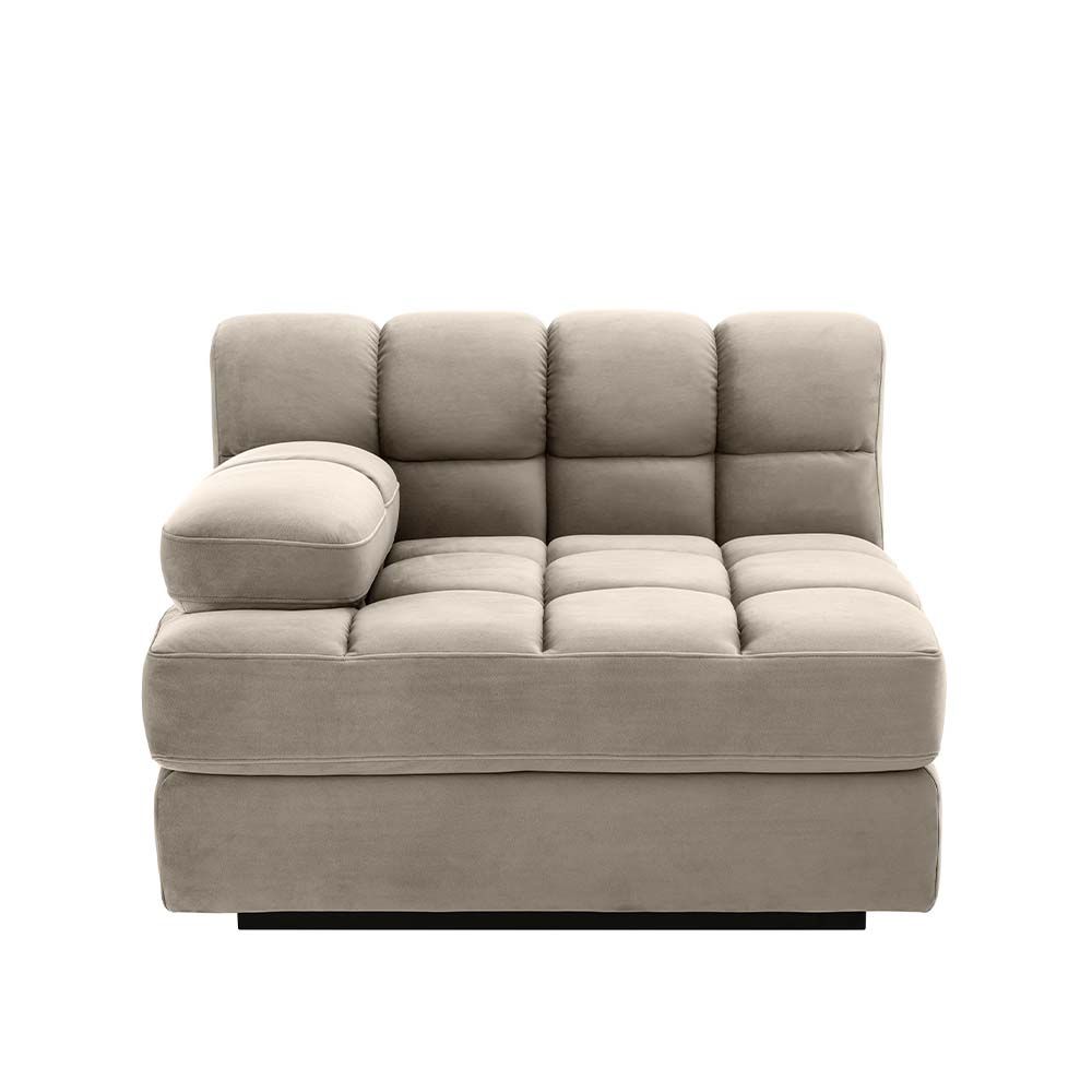 A left facing sofa upholstered in a greige velvet and a black base
