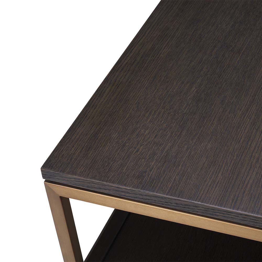 A fabulous dark brown tv unit with three drawers and brass frame accents