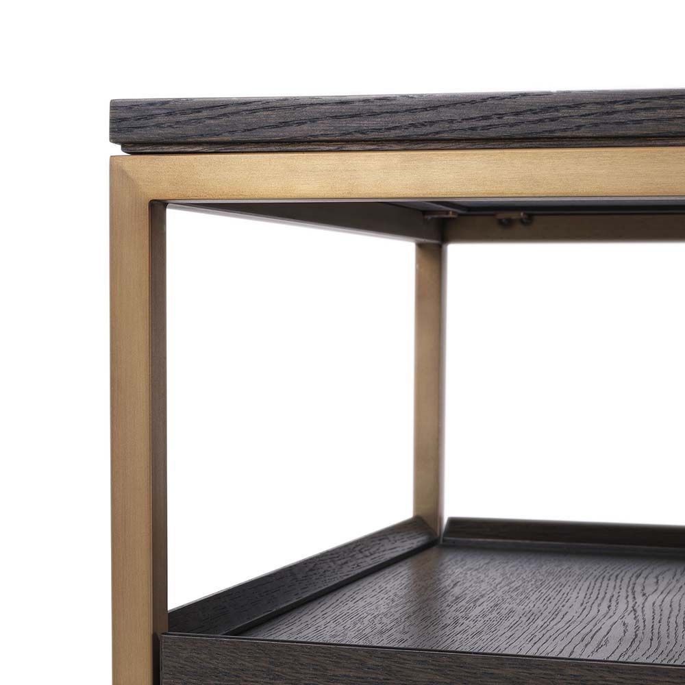 A fabulous dark brown tv unit with three drawers and brass frame accents