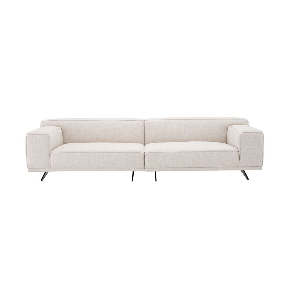 A gorgeous sofa by Eichholtz with a Pausa Natural upholstery, piping and curved black legs