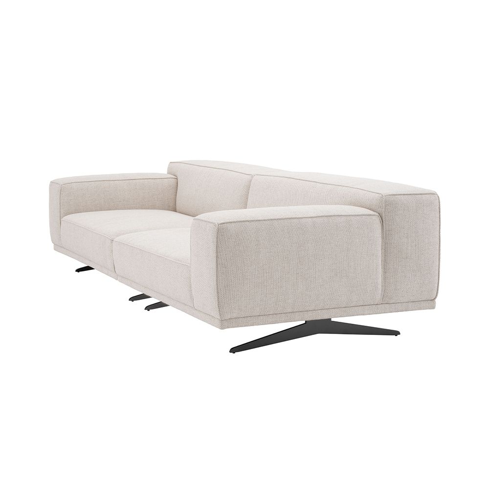 A gorgeous sofa by Eichholtz with a Pausa Natural upholstery, piping and curved black legs