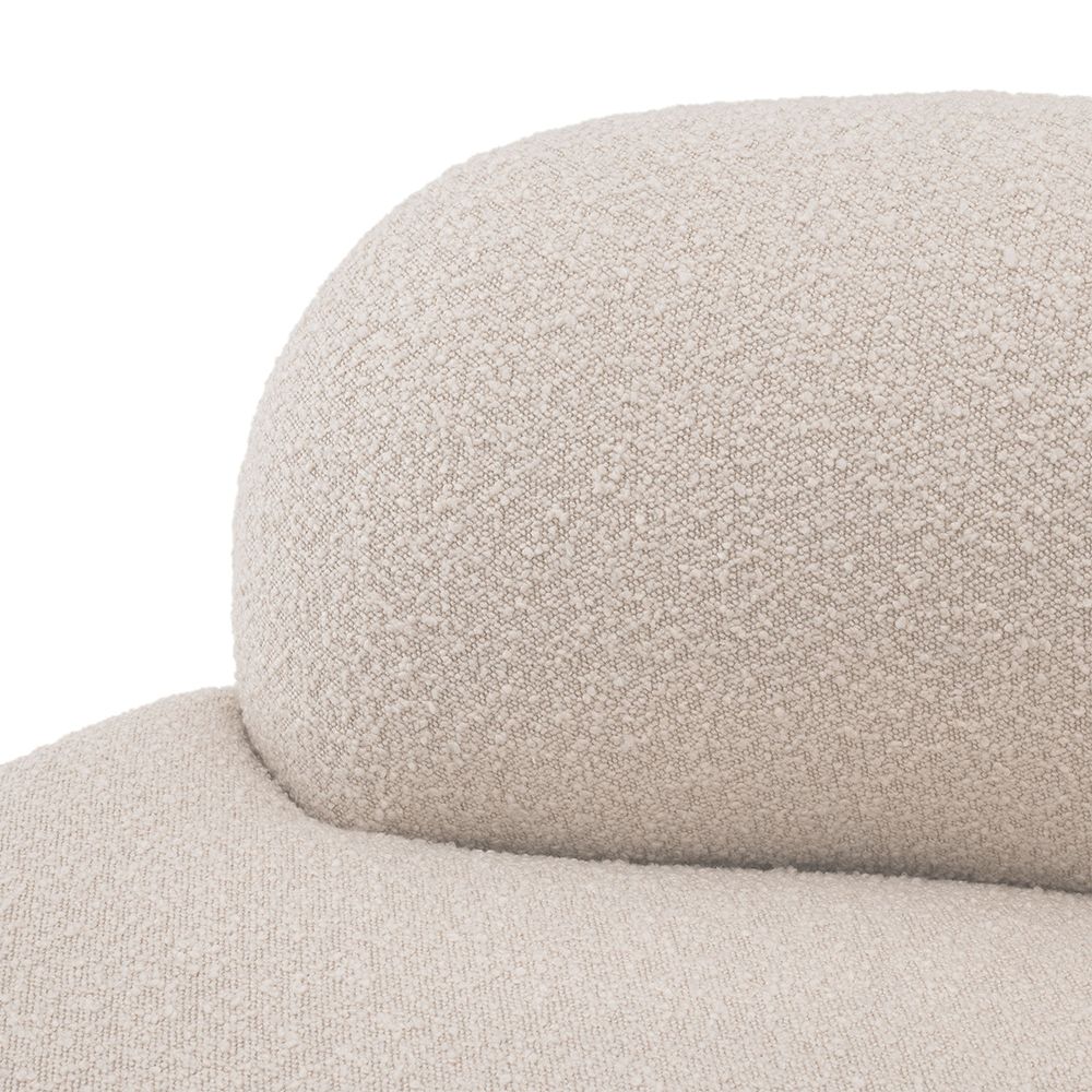 A luxurious round sofa by Eichholtz with a dreamy boucle cream upholstery and a sleek black base