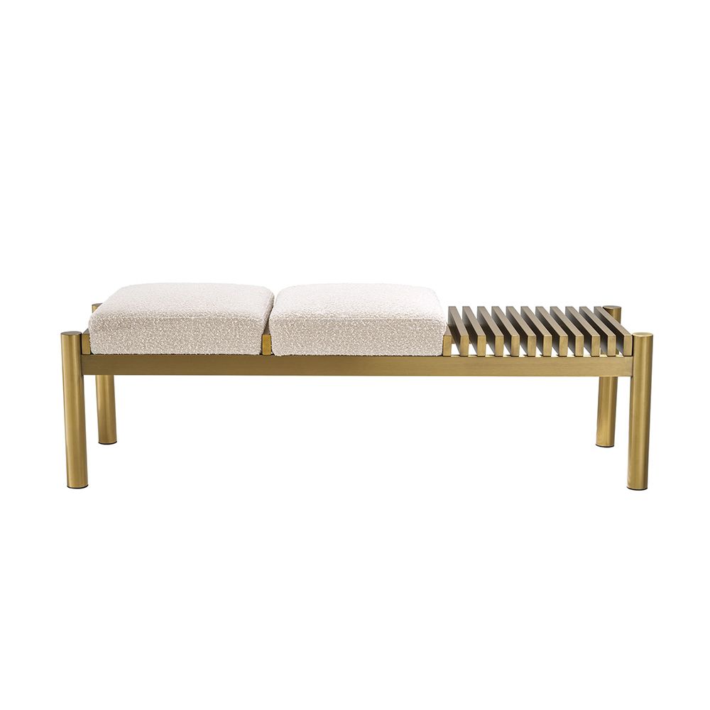 A glamorous bench by Eichholtz with two dreamy boucle cream upholstered seats and a beautiful brushed brass finish