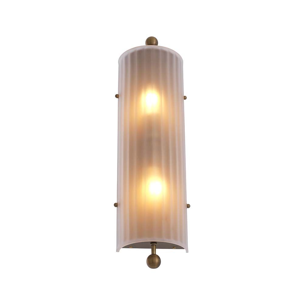 A delicate frosted glass wall lamp with antique brass details
