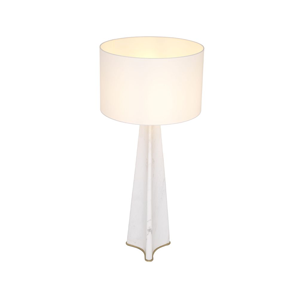 A luxury table lamp by Eichholtz with a sophisticated base, stylish fabric shade and alluring antique brass finish