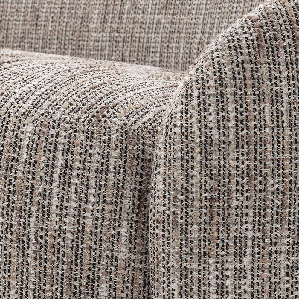 Curved sofa upholstered in a beige fabric.