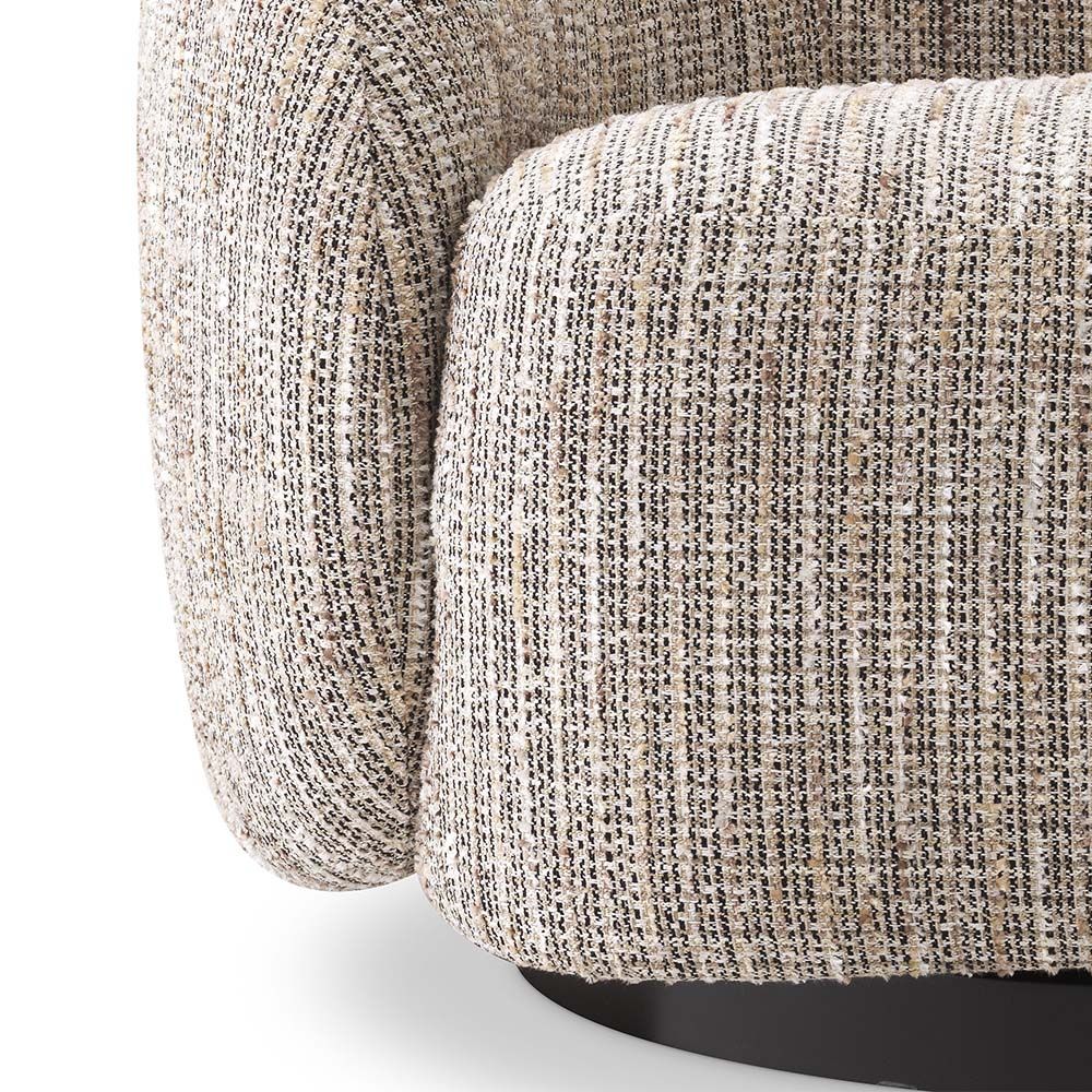 A rustic inspired swivel chair upholstered in a beige like fabric.