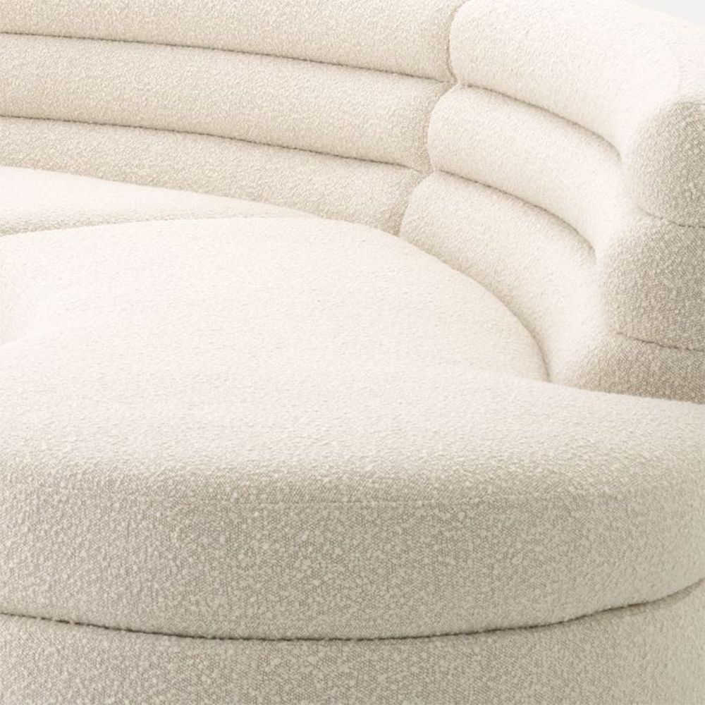 A dreamy boucle cream curvaceous sofa by Eichholtz 