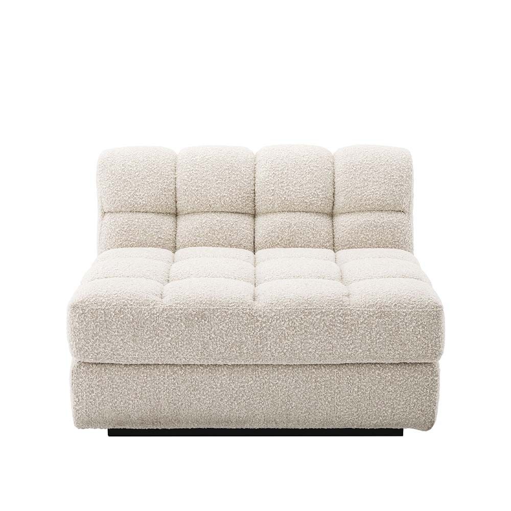 Middle sofa section upholstered in a boucle cream fabric with a black base.