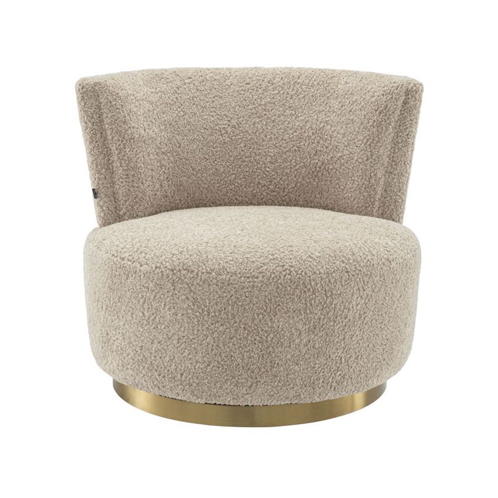A luxuriously soft curvaceous swivel chair by Eichholtz with a brushed brass swivel base