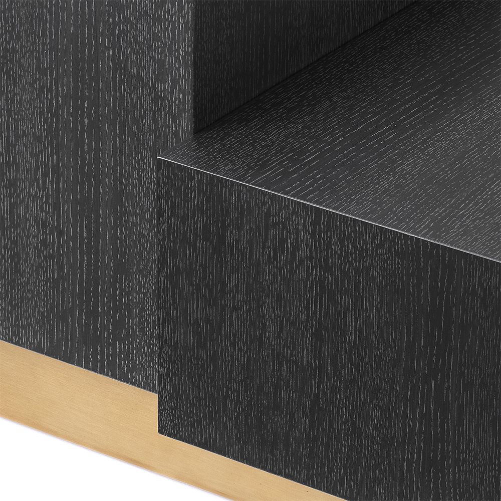 A bold and beautiful side table by Eichholtz with two blocks crafted from charcoal grey oak veneer and a brushed brass base