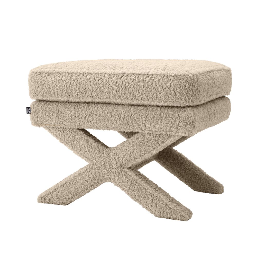 A stunning fluffy brown ottoman with x-shaped legs 