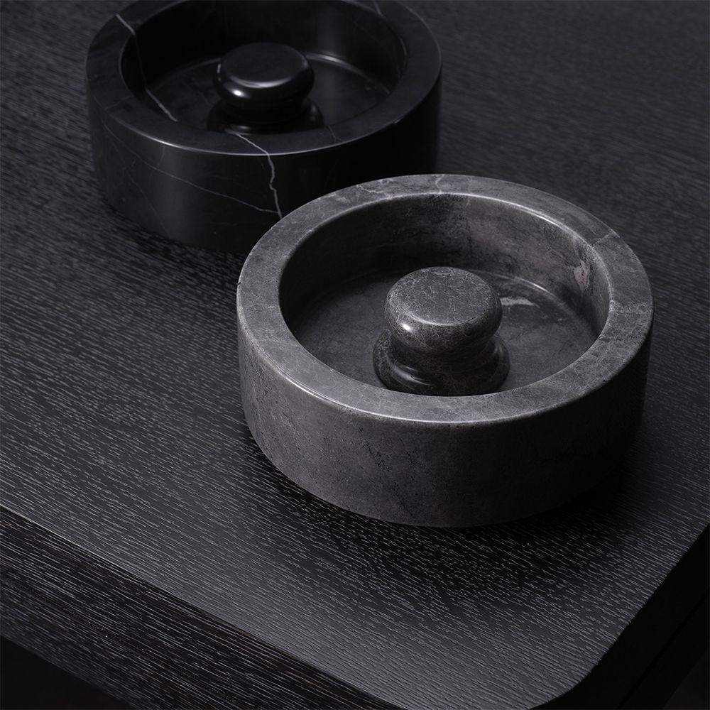 A luxurious grey marble ashtray by Eichholtz with a smooth and sophisticated charm