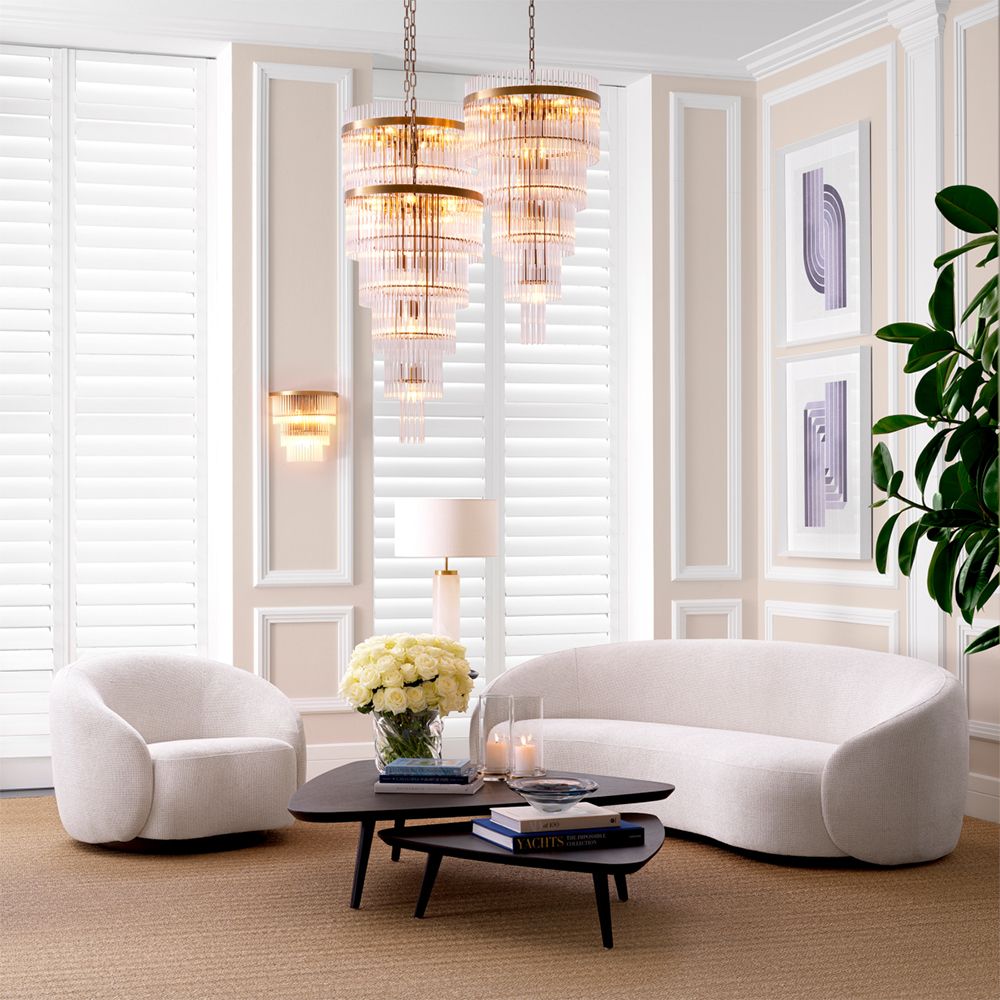 Gorgeous off-white sofa with a black base and curved back