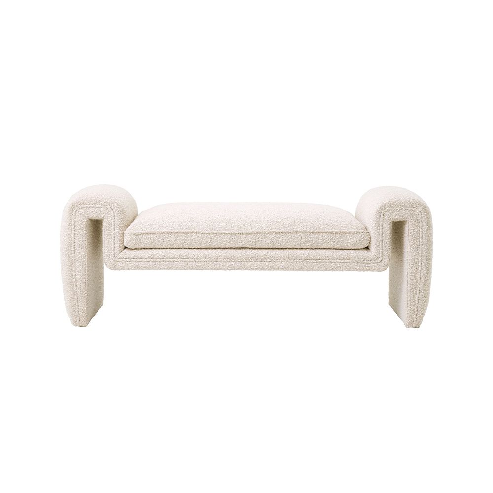 A luxurious bench by Eichholtz with a unique, free flowing design and bouclé cream upholstery