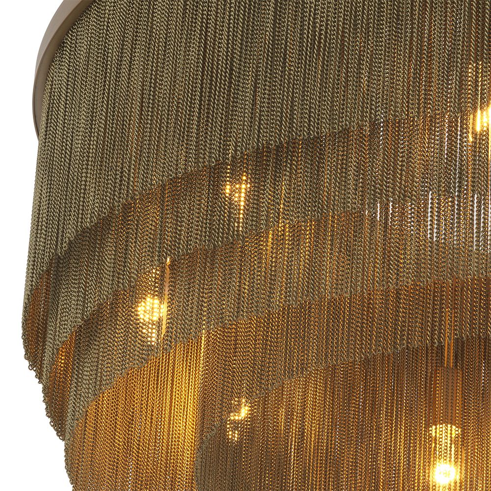 A large, eye-catching chandelier by Eichholtz inspired by the 1920s with four rows of thin chains and an antique brass finish 