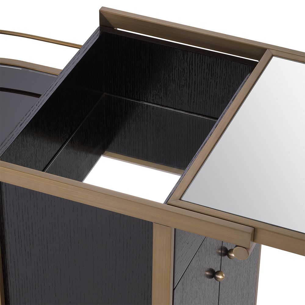A contemporary drinks trolley by Eichholtz with a glamourous brushed brass finish 