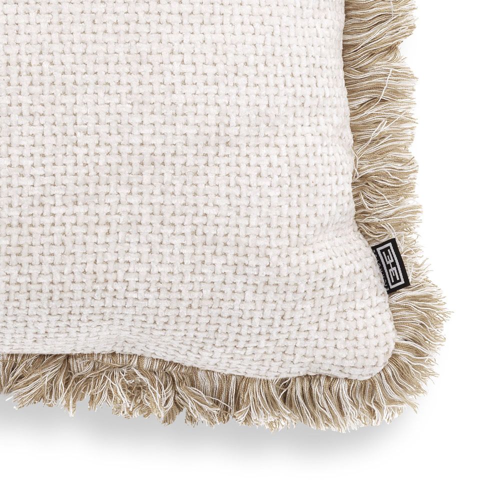 Delicate and inviting cushion with neutral colours and fringe