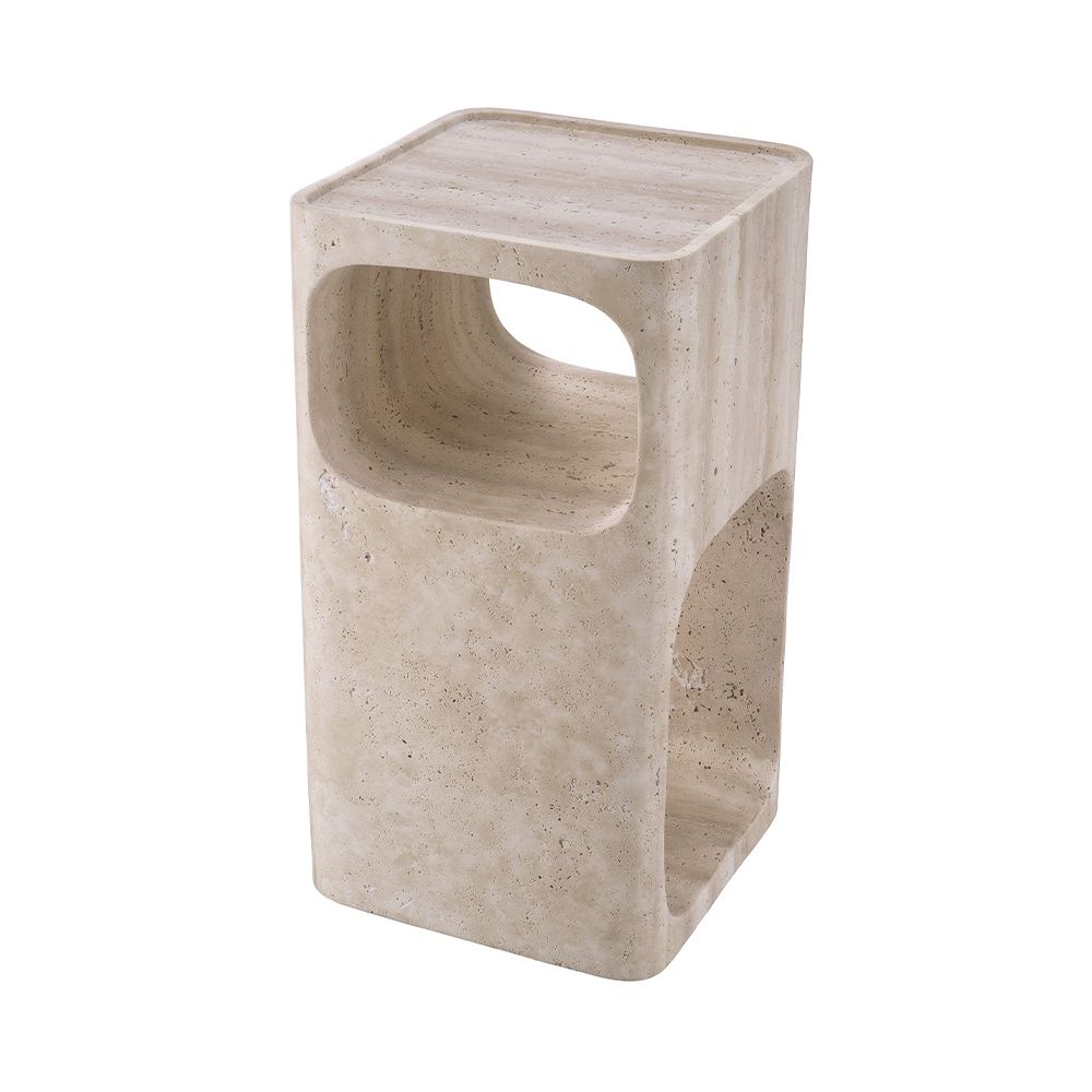 A sculptural side table by Eichholtz crafted from travertine with a Mid-Century appeal and multiple storage levels
