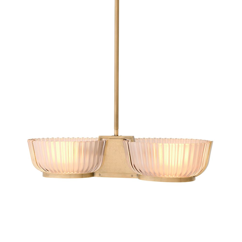 An elegant chandelier by Eichholtz with a vintage brass finish and frosted glass shades