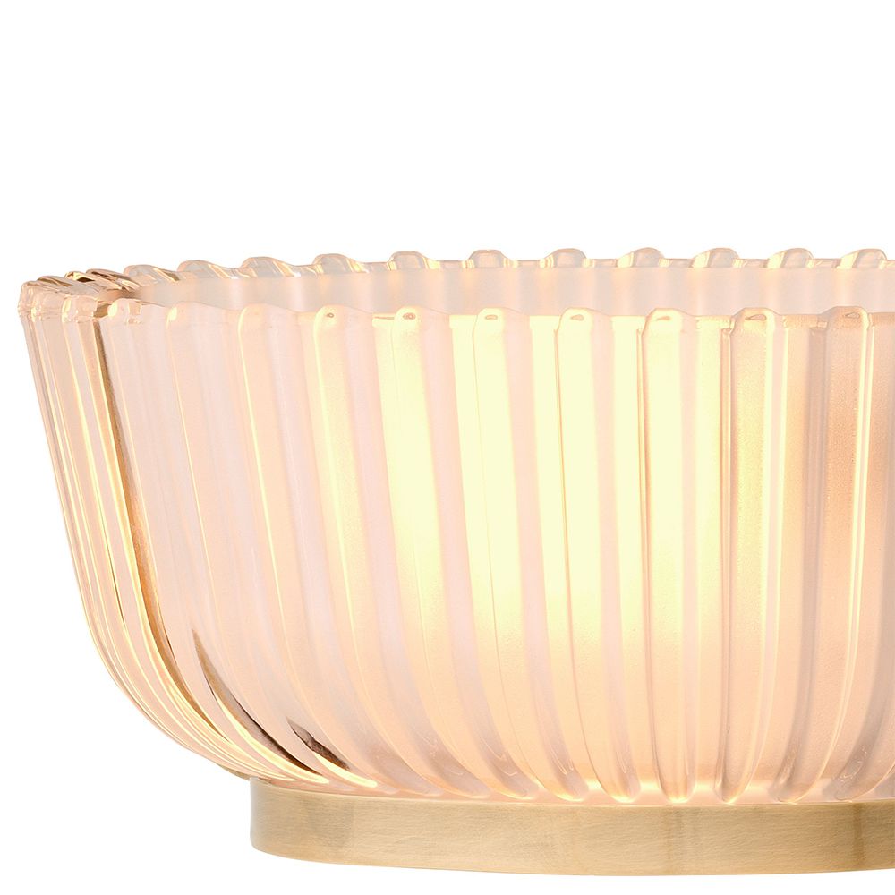 An elegant chandelier by Eichholtz with a vintage brass finish and frosted glass shades