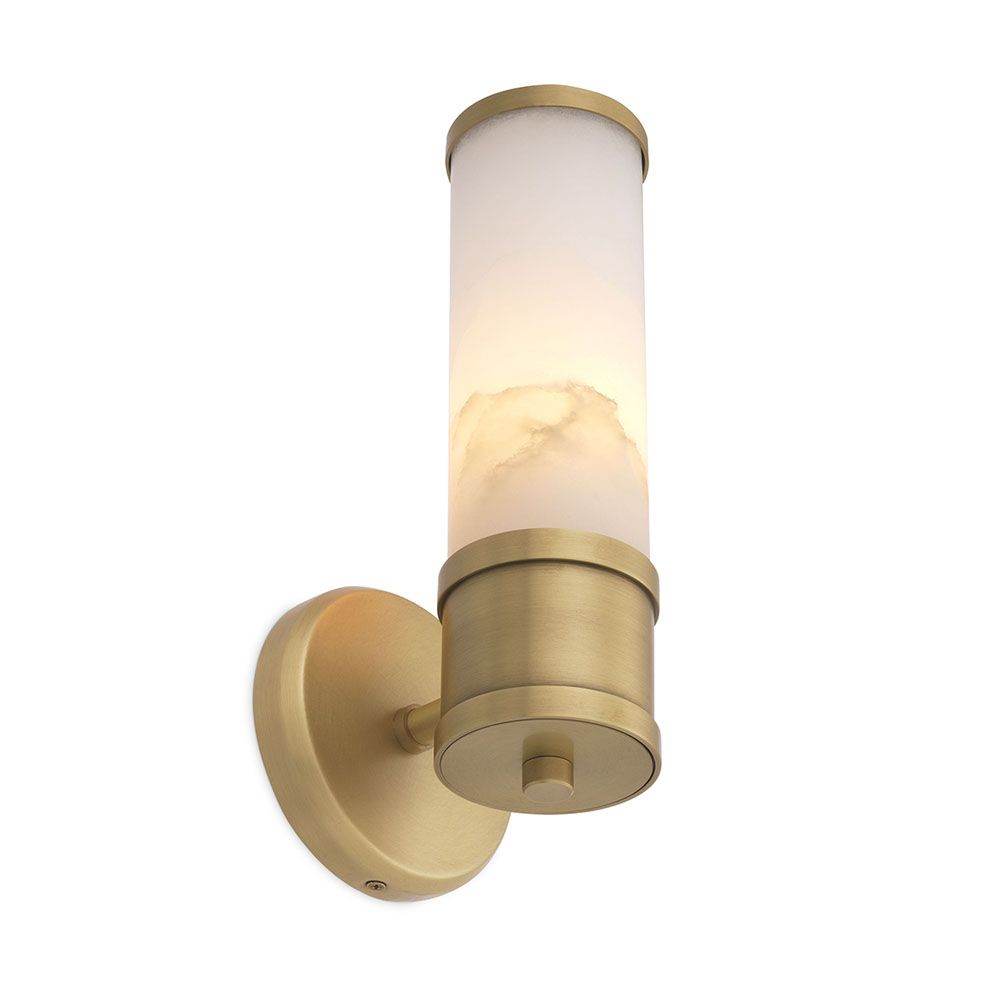 A glamourous wall lamp by Eichholtz with a cylindrical alabaster shade and brushed brass base