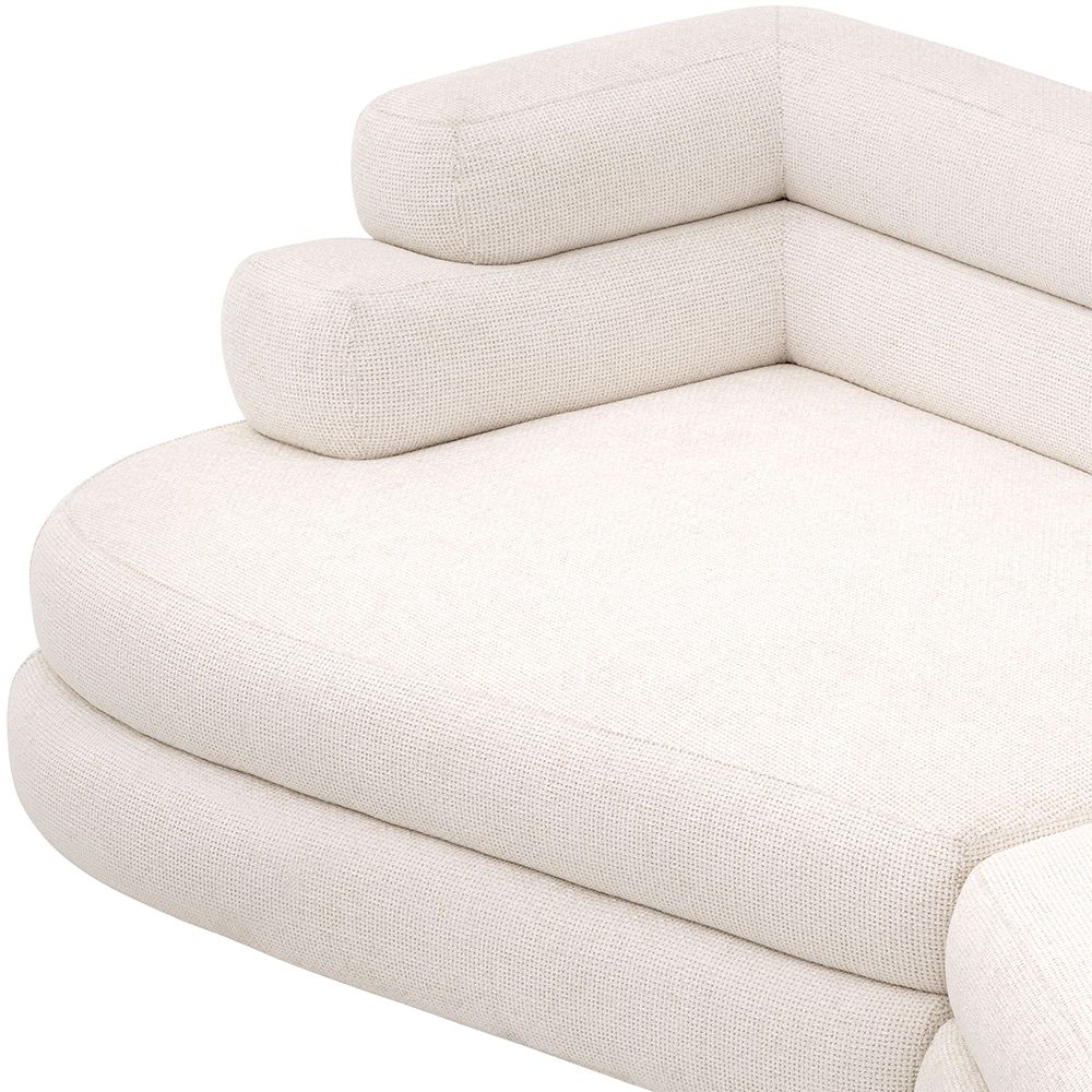 A contemporary sofa by Eichholtz with sumptuously soft curves and a luxury Lyssa Off-White upholstery