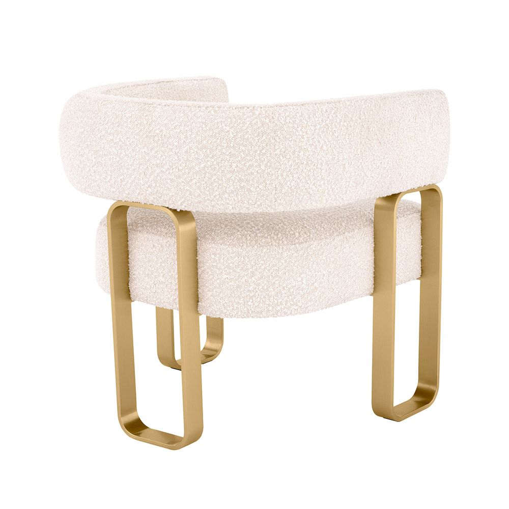 Glamorous design armchair with wrap-around backrest and rectangular brass legs