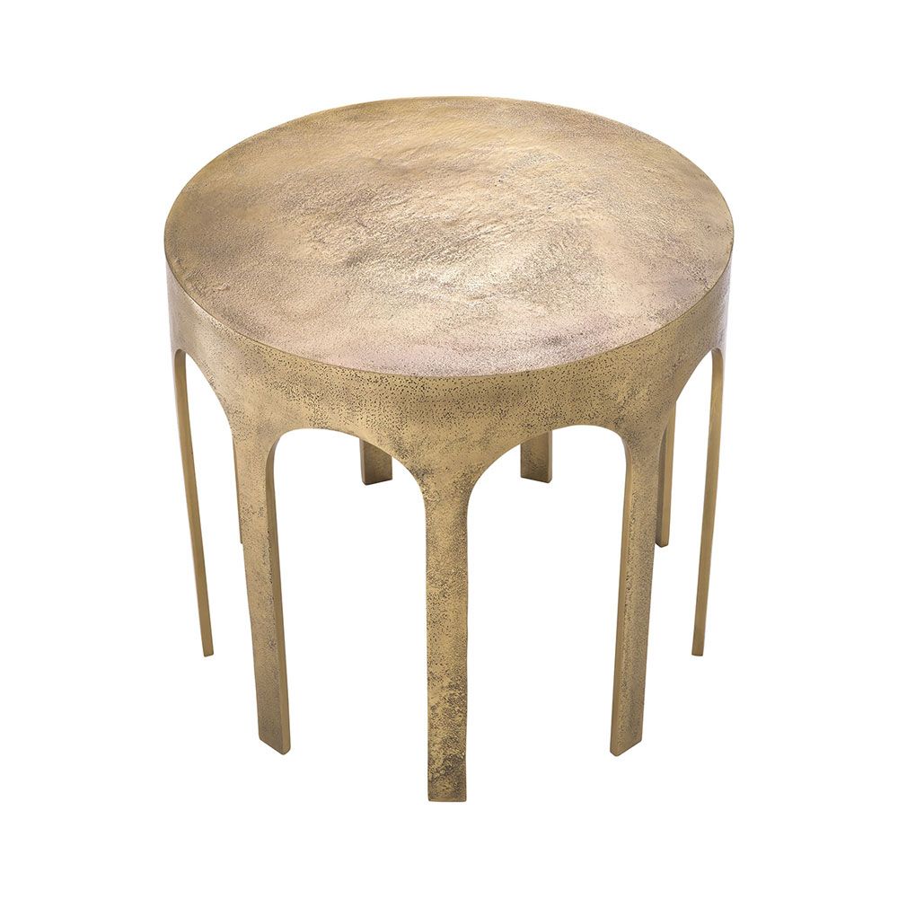 A striking side table by Eichholtz with arched details and a vintage brass finish