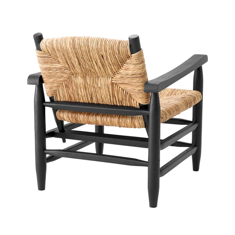 Bold black frame armchair with rustic woven backrest and seat