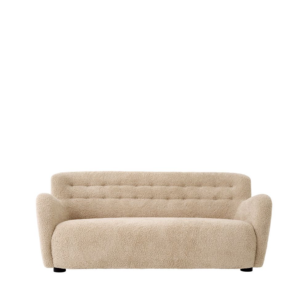 Cosy canberra sand upholstered sofa with sumptuous curves and deep stitching details