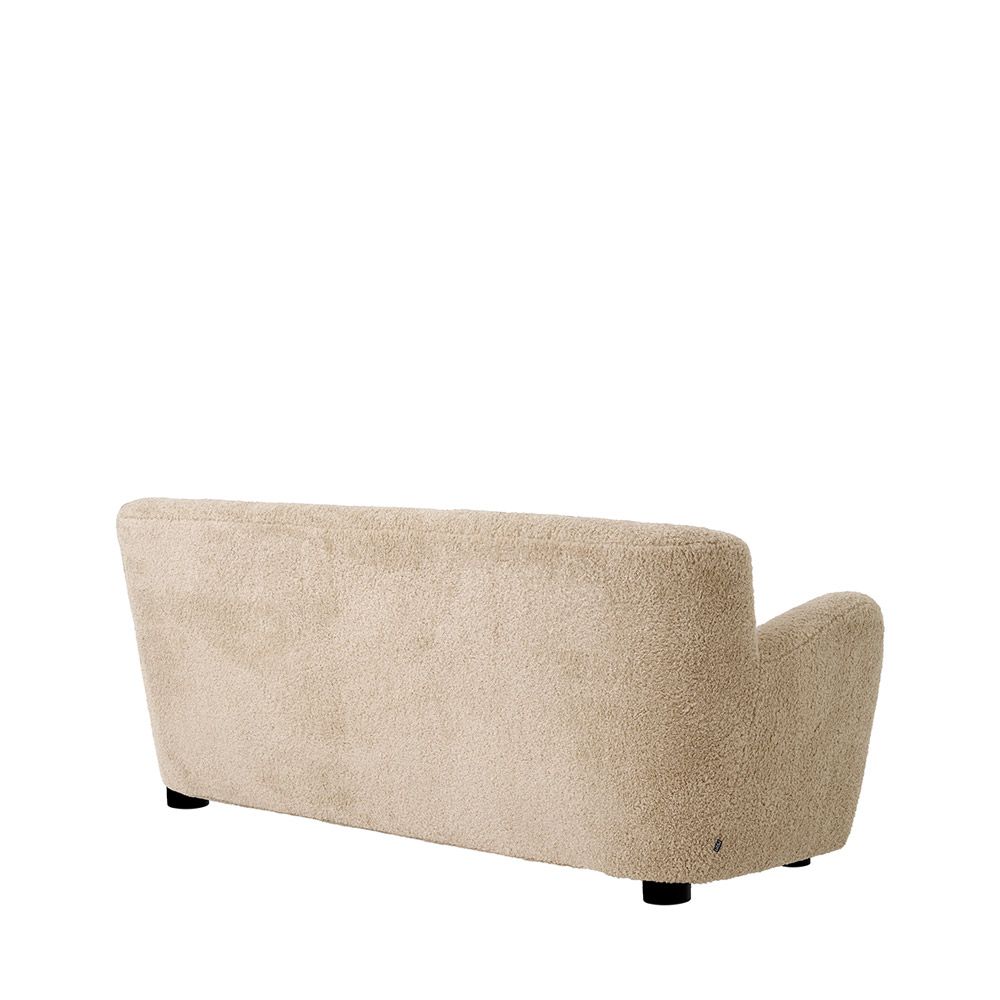 Cosy canberra sand upholstered sofa with sumptuous curves and deep stitching details