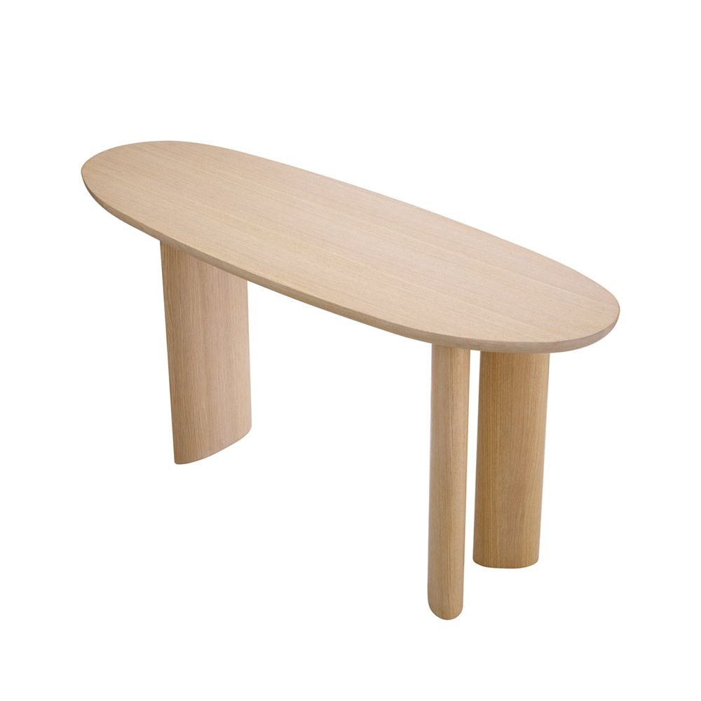 A gorgeous console table by Eichholtz with a natural finish and asymmetrical legs