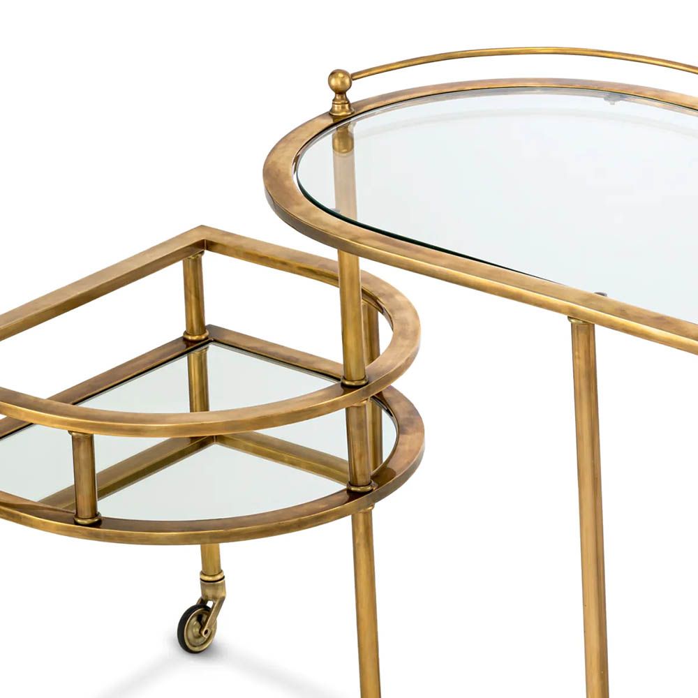 Vintage brass trolley paired with elegant mirrored glass top and clear glass layer