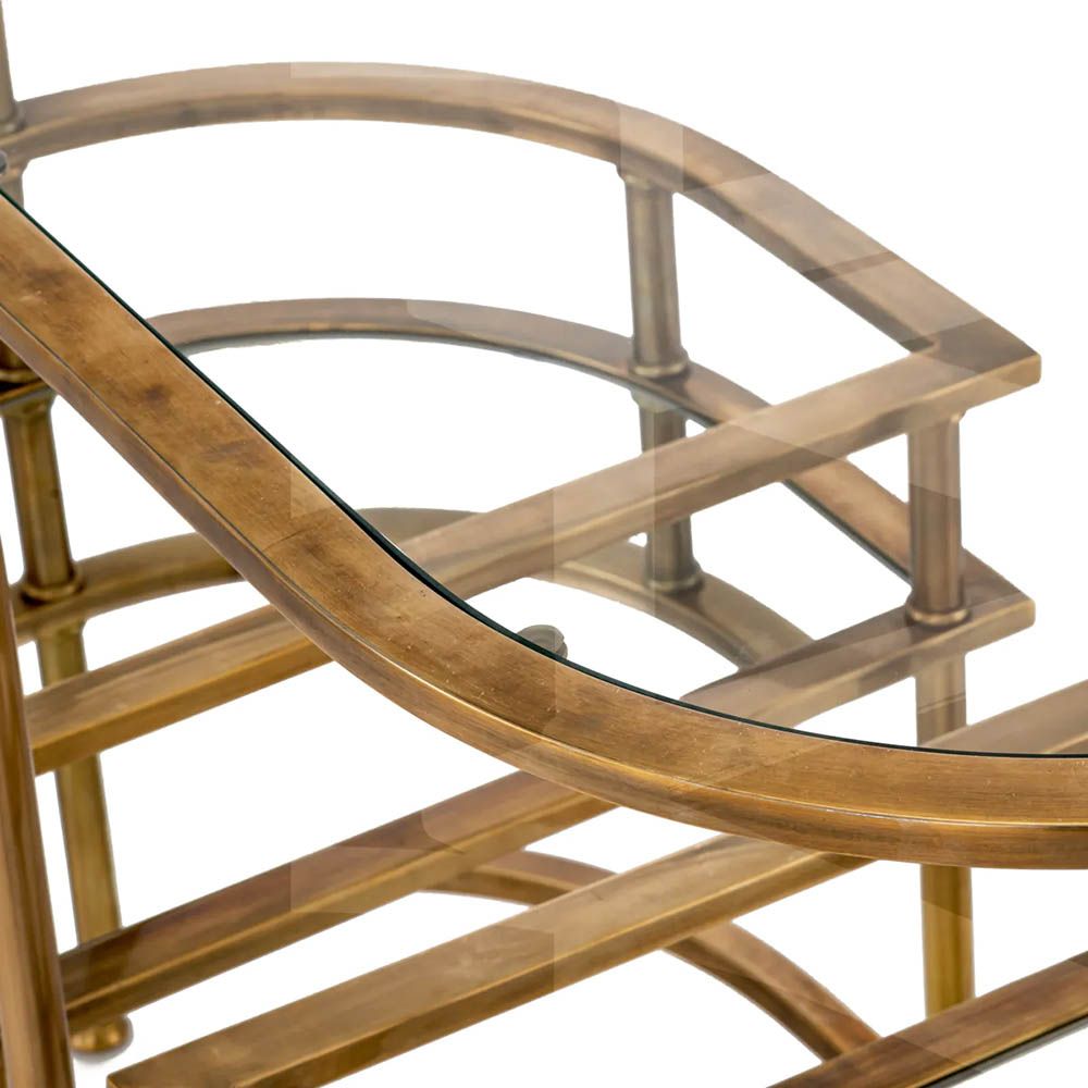Vintage brass trolley paired with elegant mirrored glass top and clear glass layer