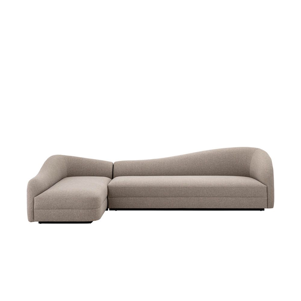 Luxurious sofa with curved backrest in grey upholstery
