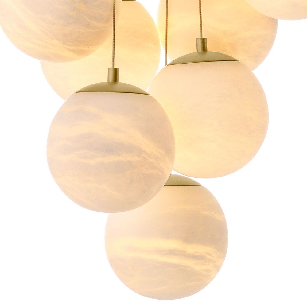 Elegant chandelier featuring suspended orb design and brass plate