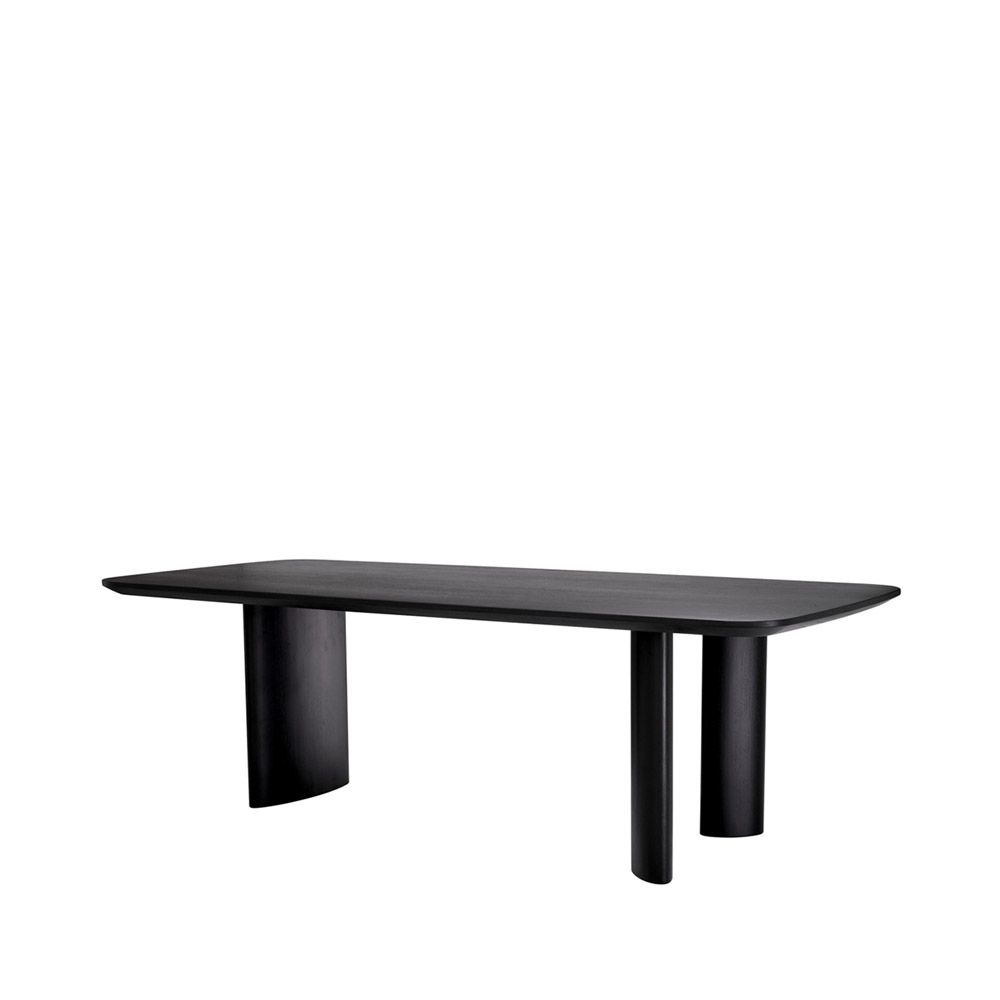 A luxury black veneer dining table by Eichholtz with offset playful table legs