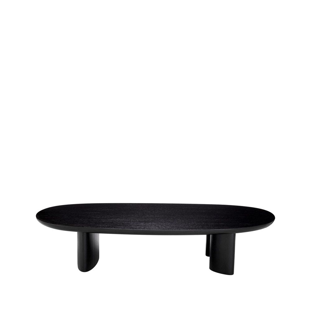 A sophisticated coffee table by Eichholtz with playfully asymmetrical legs and a beautiful black finish